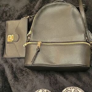 New without tags no brand black leather backpack with wristlet